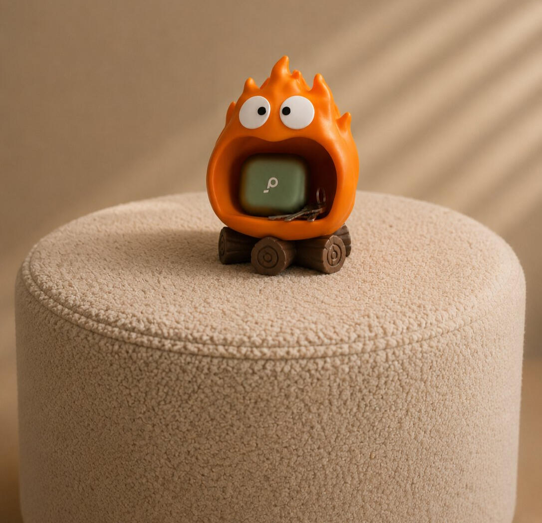 Cute fire spirit catch-all holder with wide open mouth, perfect for storing earbuds, keys, small accessories, and desk essentials.